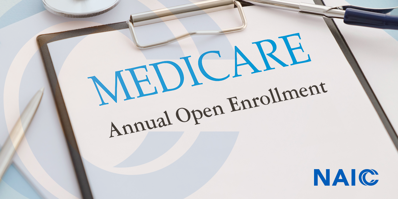 Clipboard that has "Medicare Annual Open Enrollment" written on it.