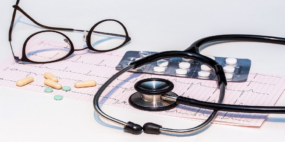 stethoscope, eye glasses and EEG chart