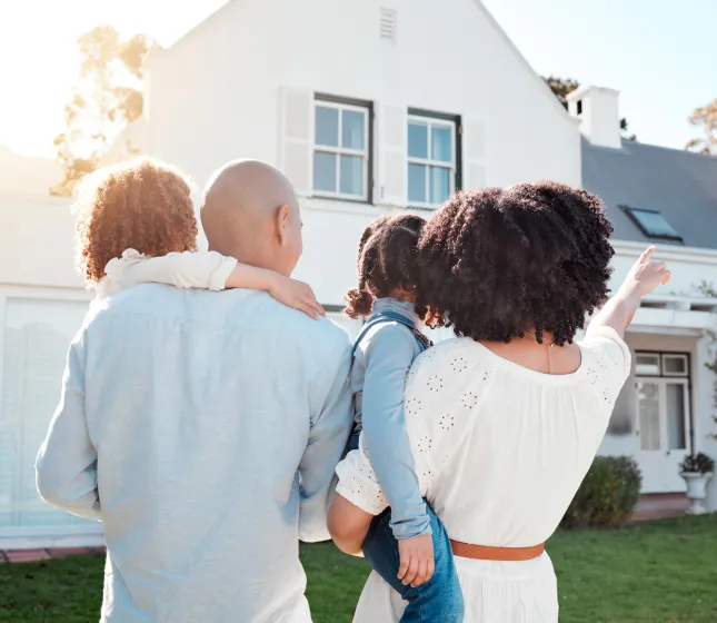 Family looking at their new house